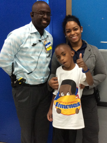 Leroy with Mr. El and Ms. Rosland donating lemonade to WalMart's Easter Egg Hunt