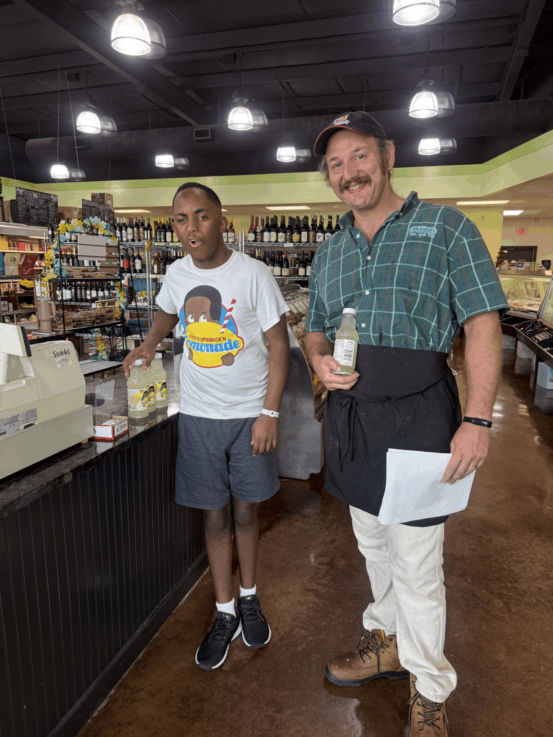 Leroy with staff at Maxwell's Market
